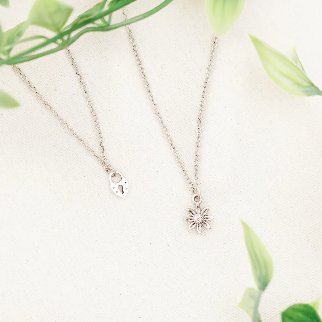 A hand-stamped Heaven Inspired piece resting on linen